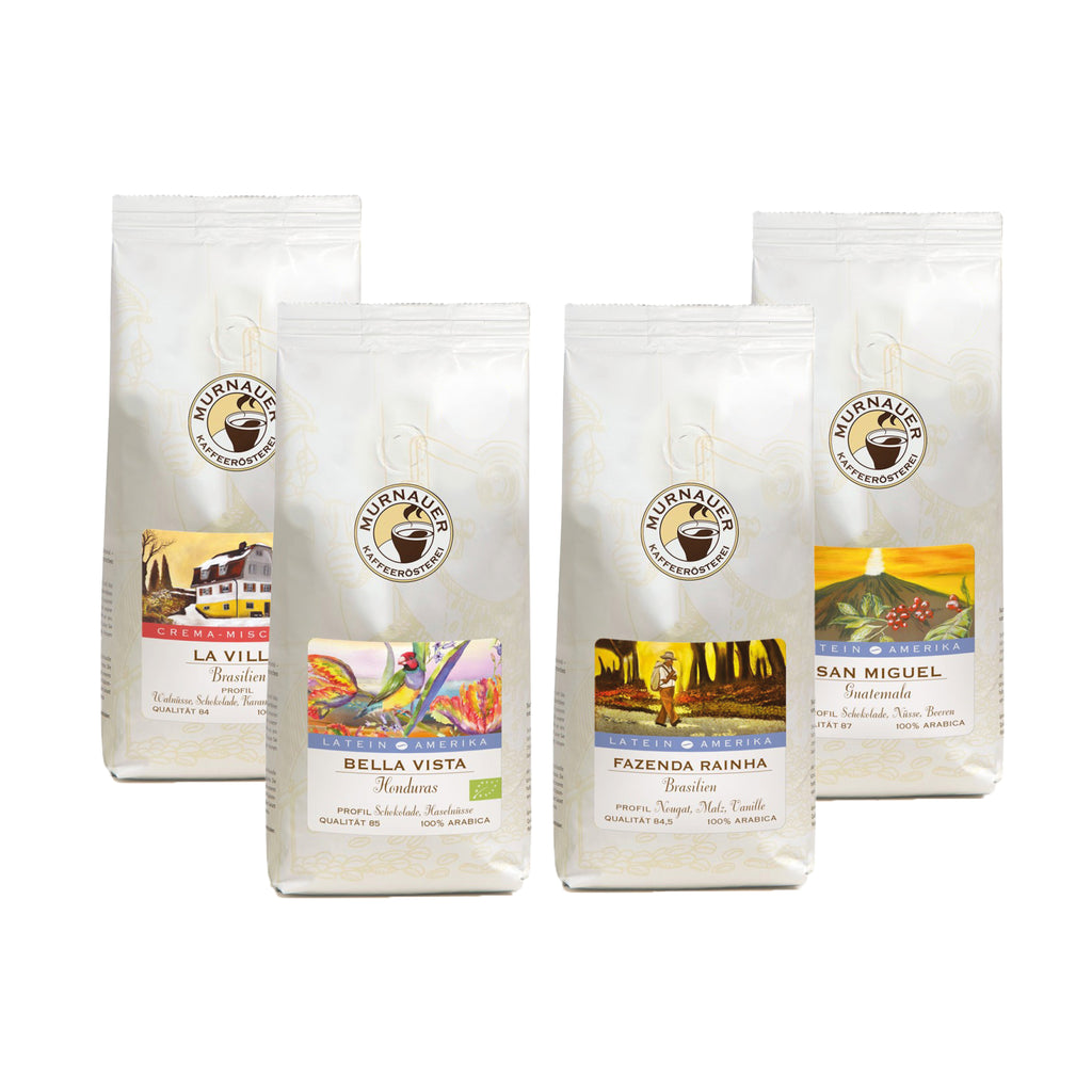 Vier weiße Kaffeepackungen Little Flower, Santa Elena, San Miguel und Suke Quto als Set Entdeckungsreise Bourbon Kaffee
