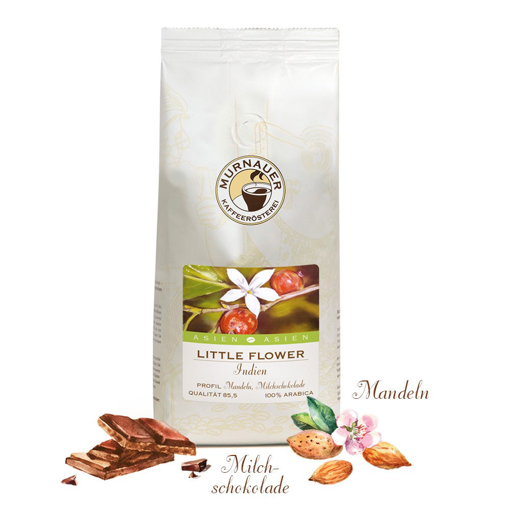Little Flower Indien Kaffee in weißer Murnauer Packung mit Kaffeeblüten, Kaffeekirschen, Milchschokolade und Mandeln davor